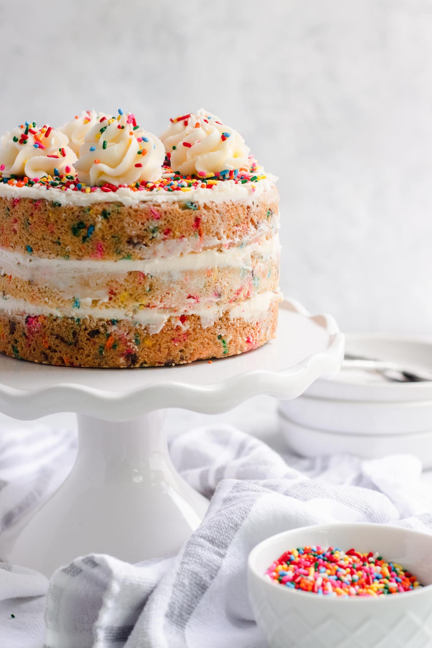 detailed photo of all the Funfetti Sugar Cookie Cake layers, recipe by by top Houston lifestyle blogger Ashley Rose of Sugar & Cloth