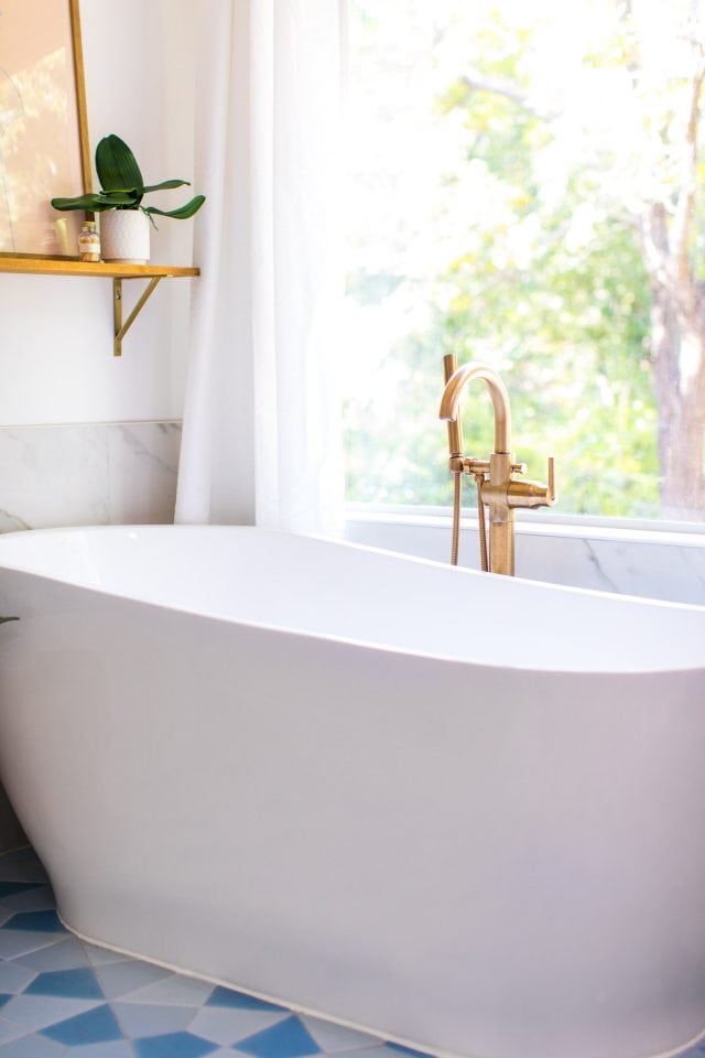 photo of a floating tub in front of window