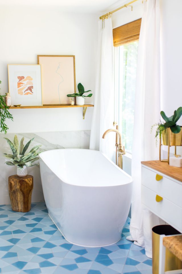 photo of a floating bathtub with statement floor tile 