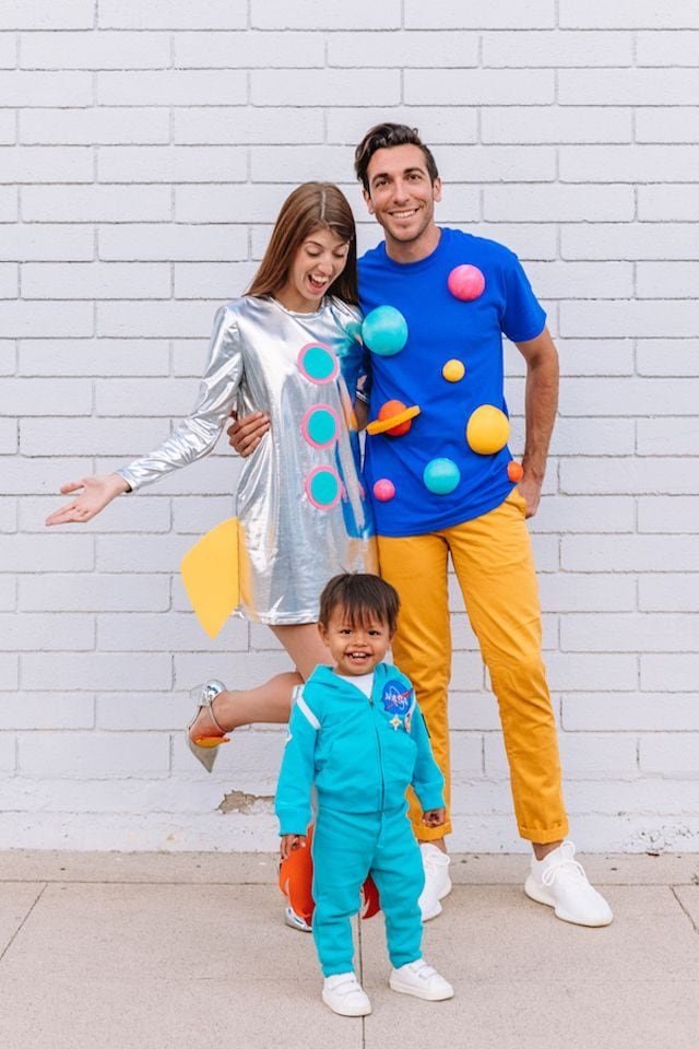 photo of family in outer space themed costumes: rocket, planets, astronaut