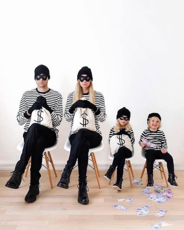 Photo of family in burglar Halloween costumes