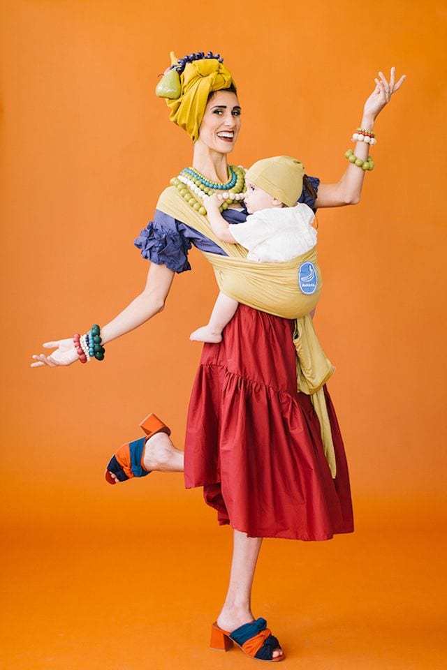 Photo of mom dressed as Chiquita Banana holding baby in DIY banana wrap: Halloween costume