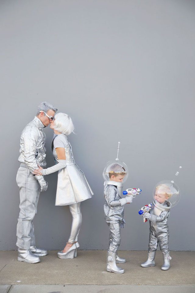 Photo of family of four in Retro Space Halloween costumes