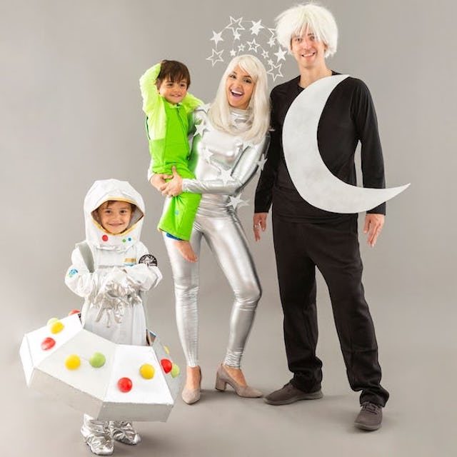 Photo of family of four in outer space themed Halloween costumes