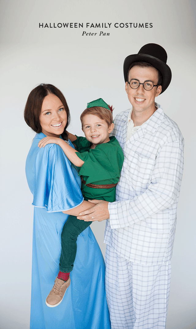 Photo of parents and child dressed in Peter Pan character Halloween costumes