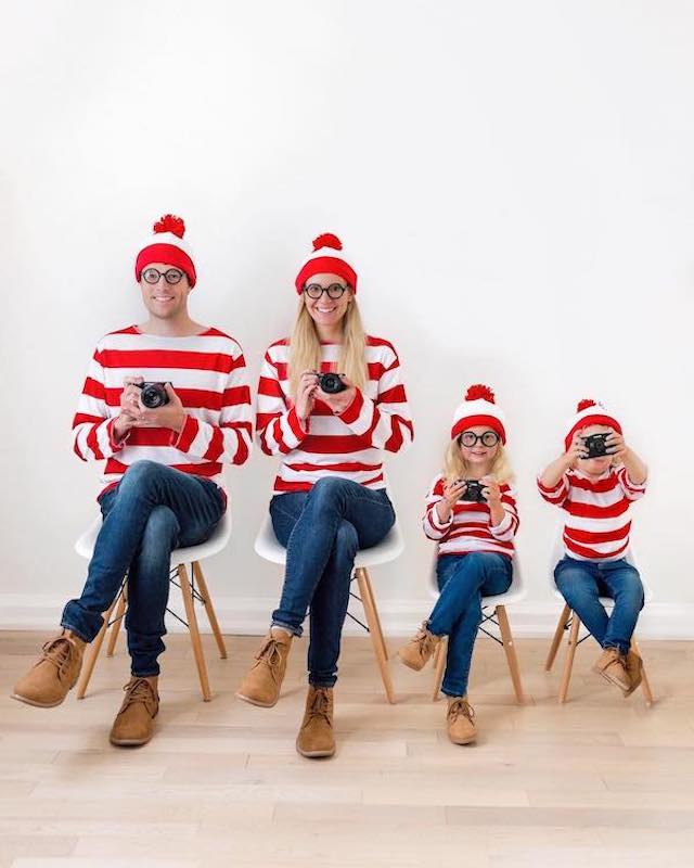 Photo of parents and two children dressed in Where's Waldo costumes for Halloween