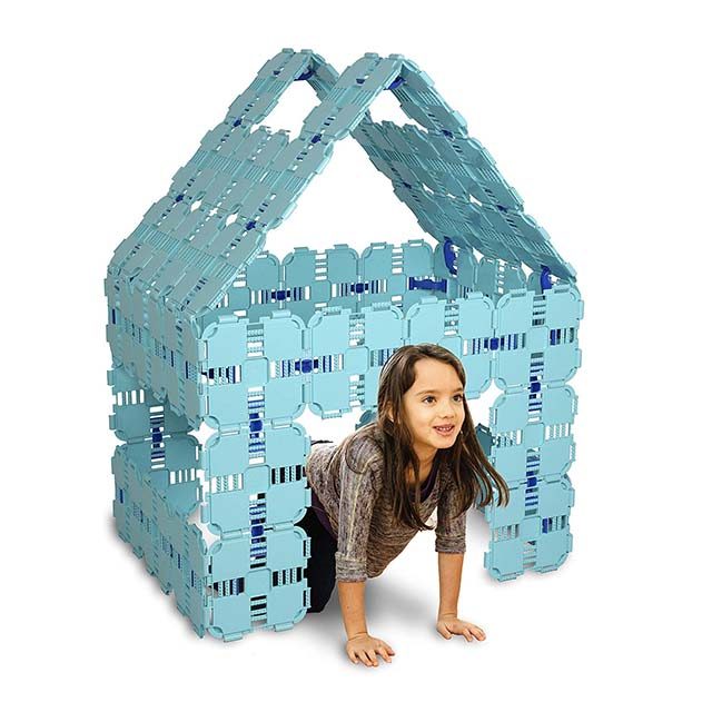 photo of young girl in collapsible toy house