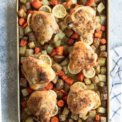photo of the healthy and easy Rosemary Lemon Chicken Sheet Pan Dinner by top Houston lifestyle blogger Ashley Rose of Sugar & Cloth