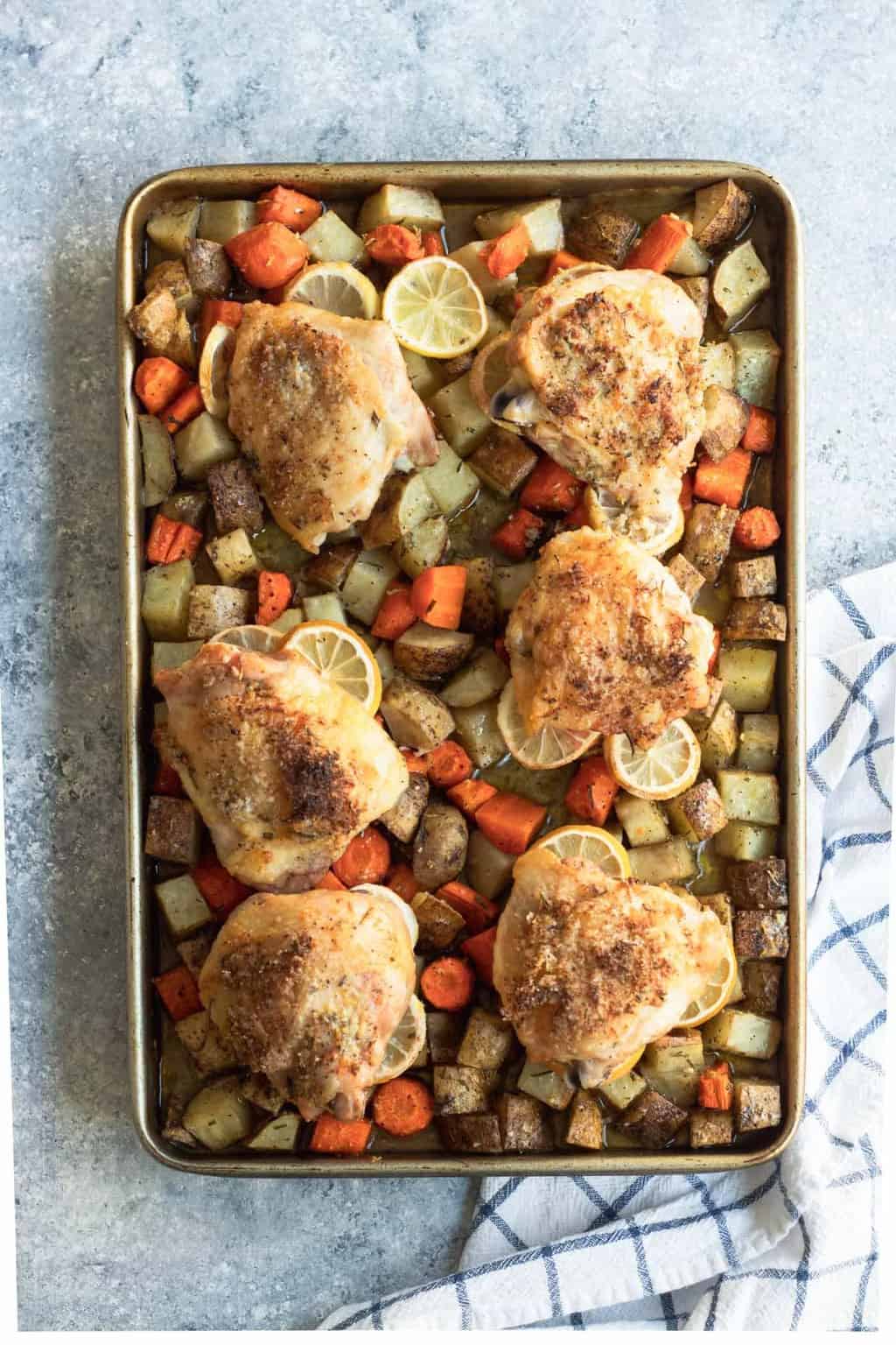 photo of the healthy and easy Rosemary Lemon Chicken Sheet Pan Dinner by top Houston lifestyle blogger Ashley Rose of Sugar & Cloth