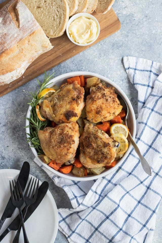 Overhead image the Lemon Rosemary Chicken Sheet Pan Dinner recipe ready to be served by top Houston lifestyle blogger Ashley Rose of Sugar & Cloth