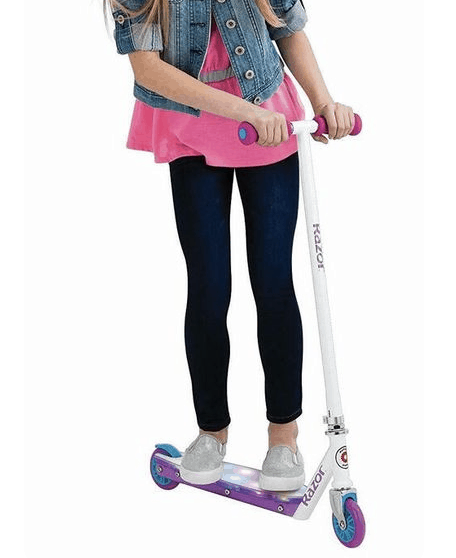 photo of a razor scooter with girl riding it