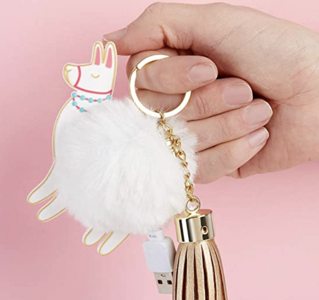 photo of poof clip on phone charger with a llama and girls hand