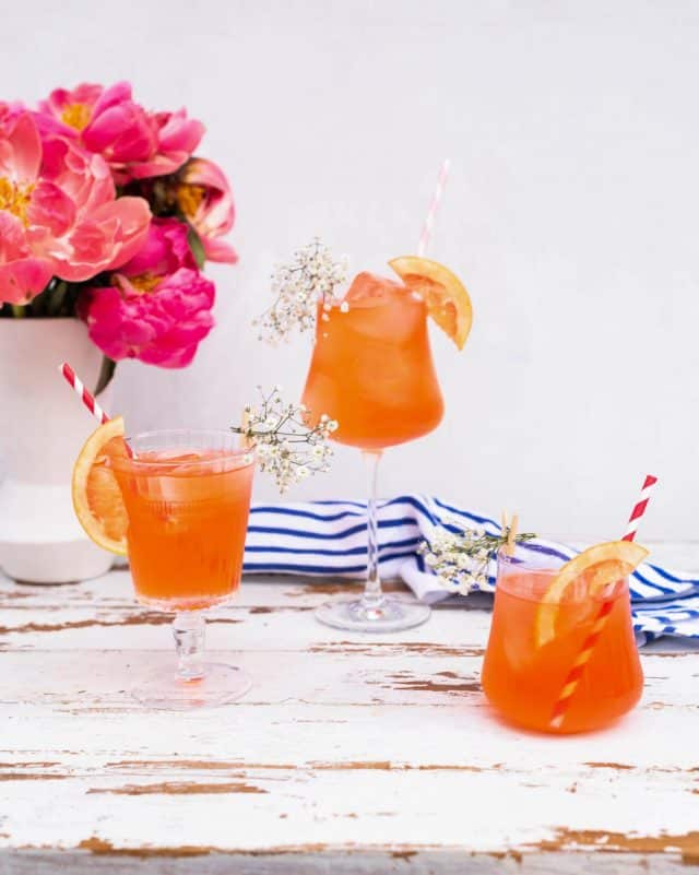 photo of three Elderflower Aperol Spritz cocktails by top Houston lifestyle blogger Ashley Rose of Sugar & Cloth