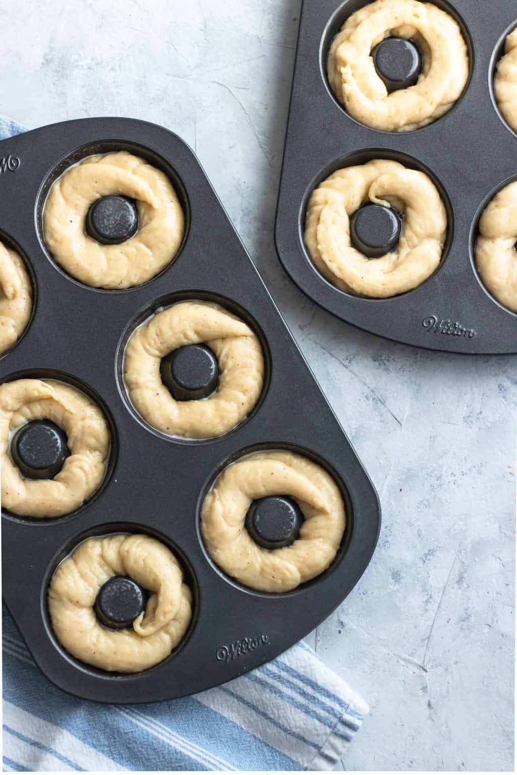 photo the gluten free donuts ready to be baked in their donut pans by top Houston lifestyle blogger Ashley Rose of Sugar & Cloth
