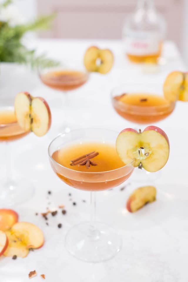 photo of the photo of the easy spiced apple cider drink apple and cinnamon stick garnishes by top Houston lifestyle blogger Ashley Rose of Sugar & Cloth