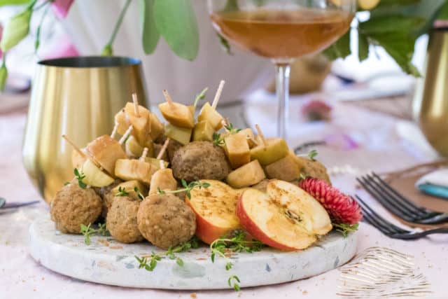 photo of the Slow Cooker Easy Meatballs garnished with apples by top Houston lifestyle blogger Ashley Rose of Sugar & Cloth