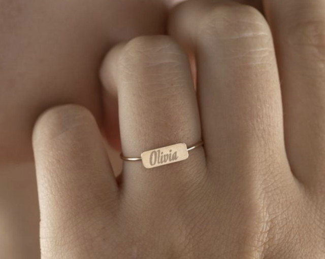 a solid gold personalized name ring as a meaningful gift for her