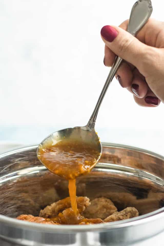 photo of the sauce for easy orange chicken by top Houston lifestyle blogger Ashley Rose of Sugar & Cloth