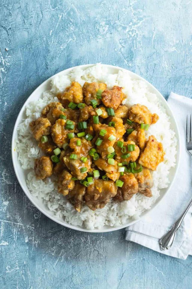 photo of the easy orange chicken recipe by top Houston lifestyle blogger Ashley Rose of Sugar & Cloth