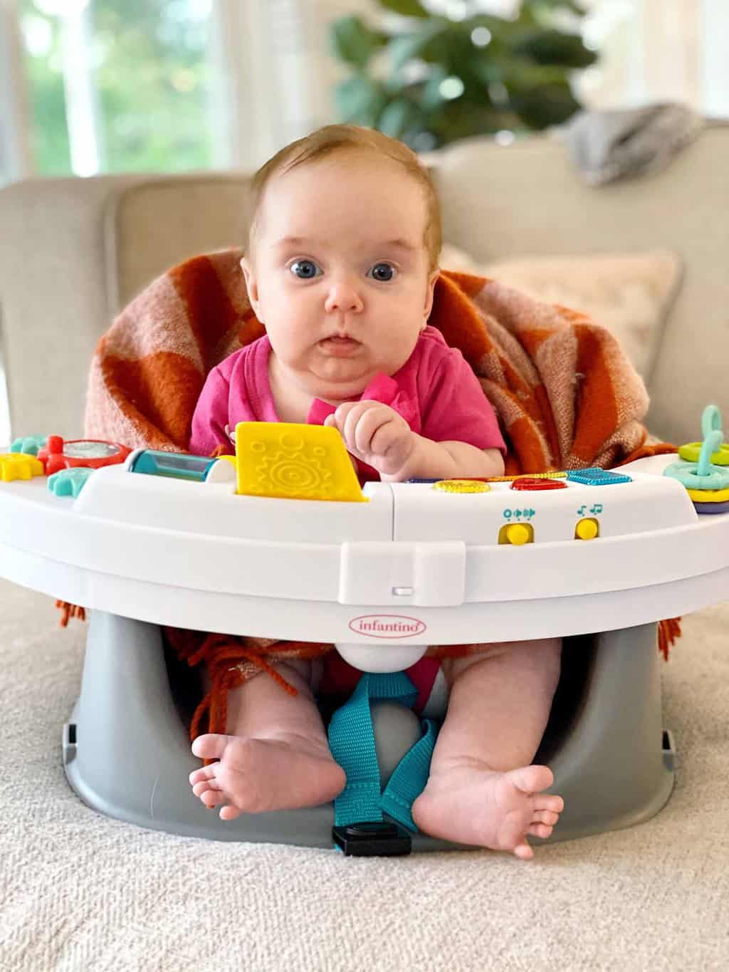 photo of baby in a play chair