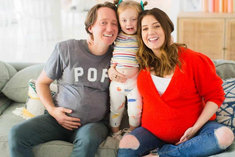 photo of my husband wearing a fake pregnant belly with our family