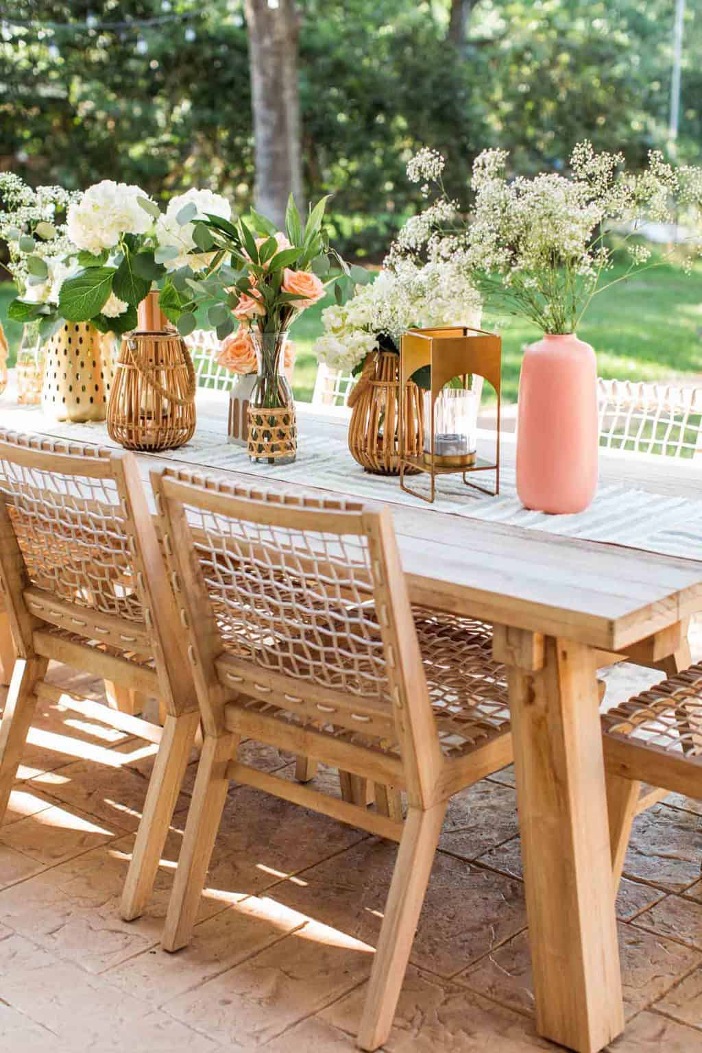 outdoor article dining table and chairs with vases