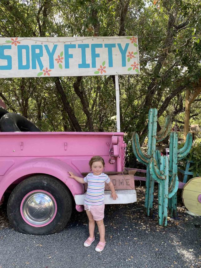 gwen in front of a pink truck