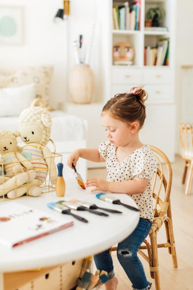photo of Gwen painting at her new DIY kids play table by top Houston lifestyle blogger Ashley Rose of Sugar & Cloth