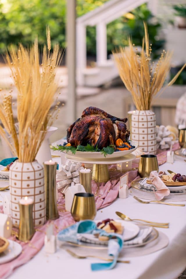 a thanksgiving table with an turkey on it