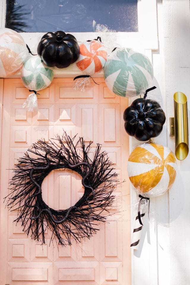 giant fake candy decorations with a black wreath
