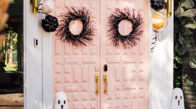 another angle view of pink double doors and halloween decorations