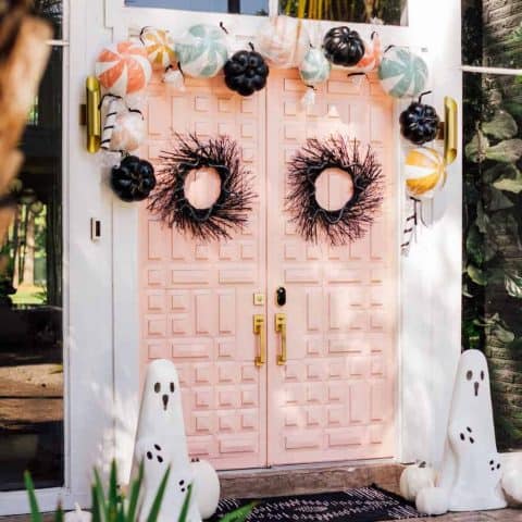 another angle view of pink double doors and halloween decorations