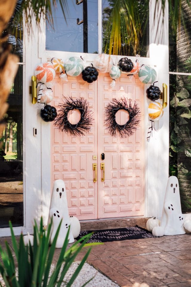 another angle view of pink double doors and halloween decorations