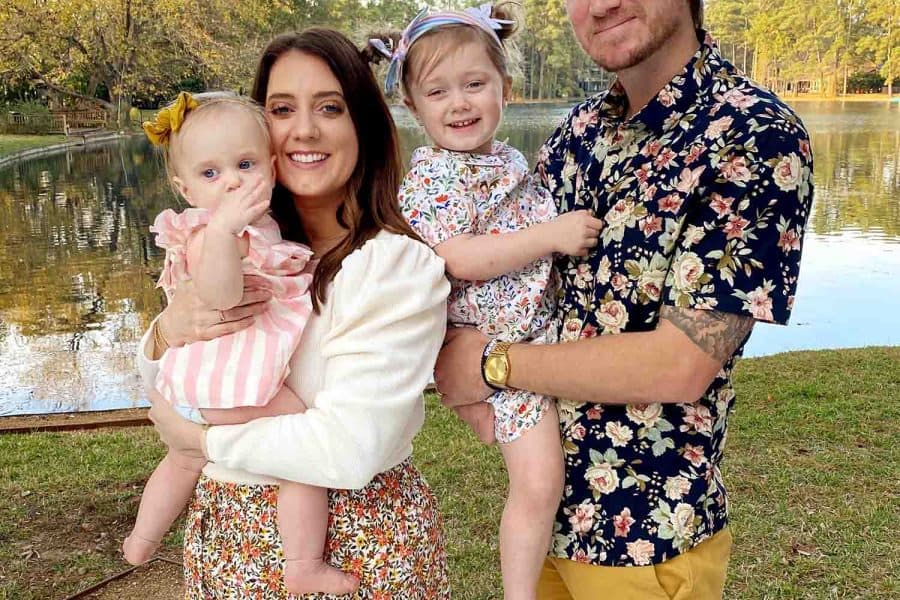 photo of a family in front of a lakeview