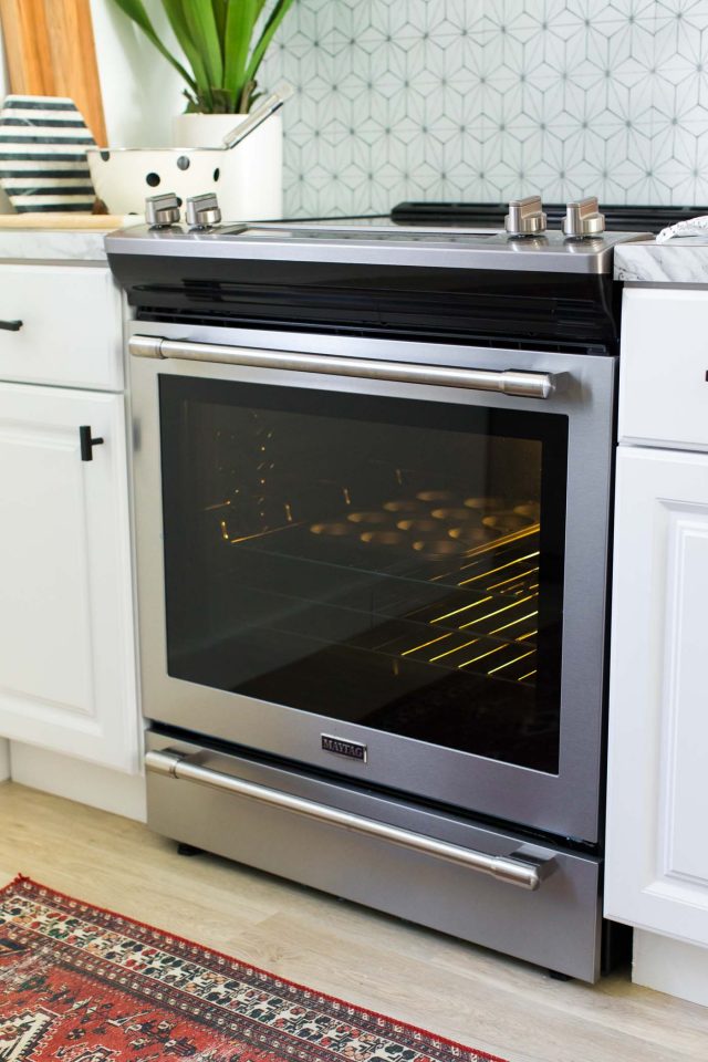 photo of the lemon cupcakes in the oven by top Houston lifestyle blogger Ashley Rose of Sugar & Cloth