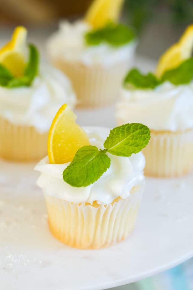 close up photo of the lemon cupcakes with lemon flavor frosting by top Houston lifestyle blogger Ashley Rose of Sugar & Cloth