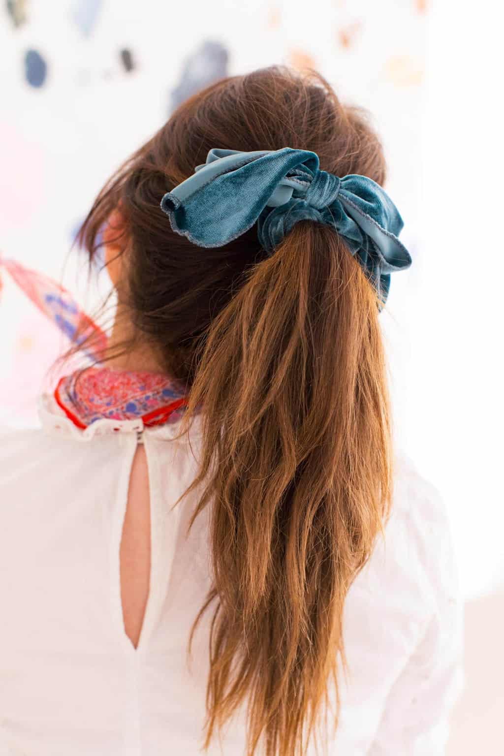 close up photo of a velvet scrunchie hair accessory by top Houston lifestyle blogger Ashley Rose of Sugar & Cloth