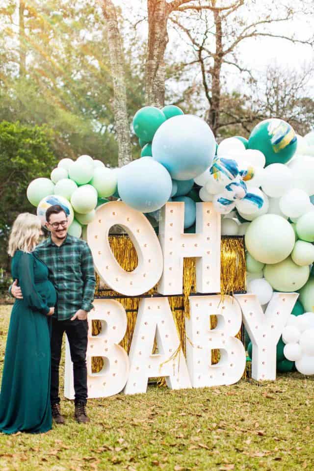 "oh baby" giant marquee letters and a man and woman