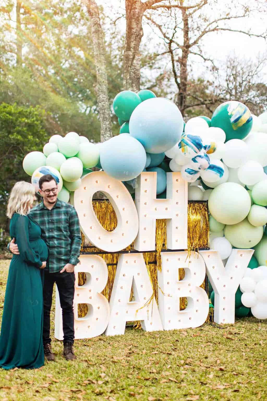 "oh baby" giant marquee letters and a man and woman