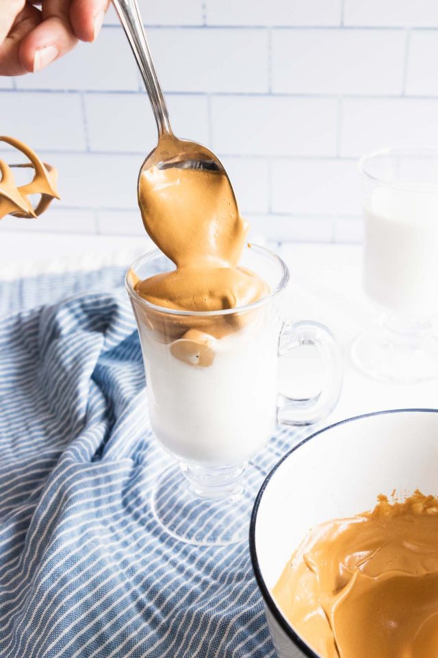 photo of the instant coffee mixed being poured over the milk by top Houston lifestyle blogger Ashley Rose of Sugar & Cloth