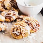photo of homemade puff pastry cinnamon rolls with vanilla glaze and almonds by top Houston lifestyle blogger Ashley Rose of Sugar & Cloth