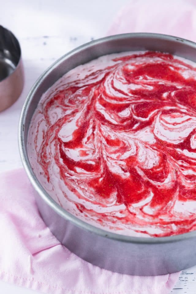 photo fo the strawberry swirl cheesecake filling by top Houston lifestyle blogger Ashley Rose of Sugar & Cloth