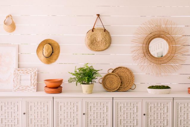 resin outdoor cabinets in front of shiplap wall