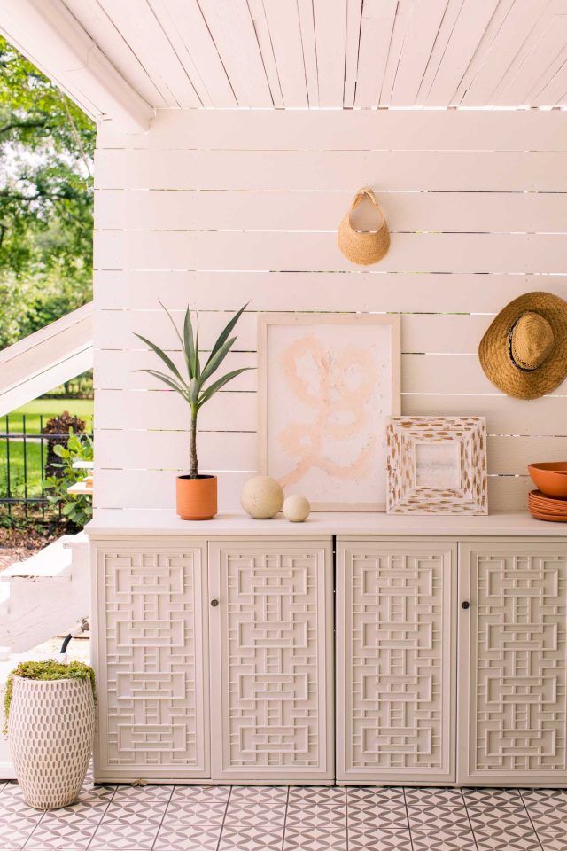 resin outdoor cabinets in front of shiplap wall