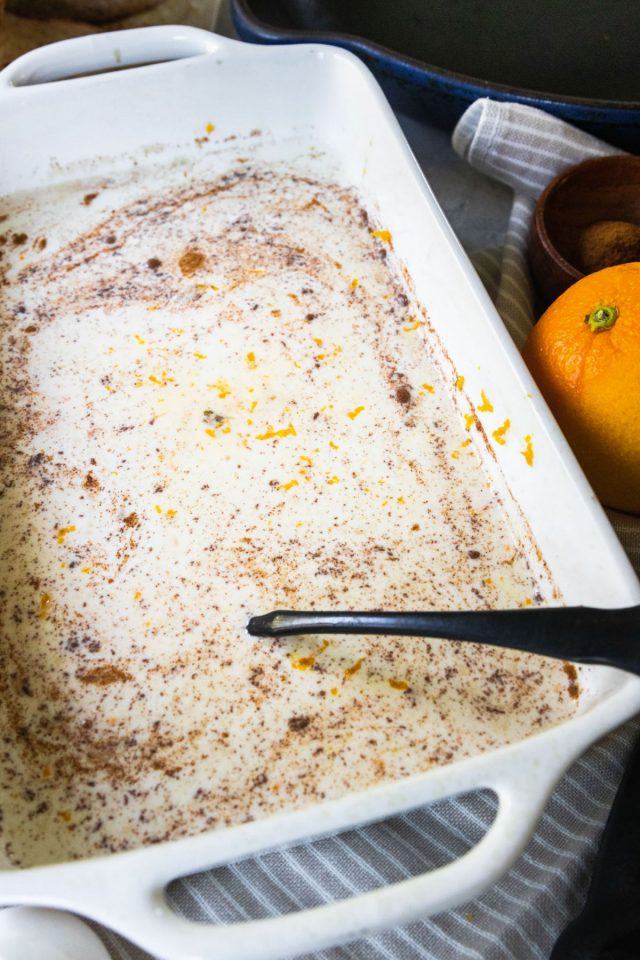 close up photo of Whole milk, heavy cream, eggs, vanilla extract, cinnamon, orange zest in a pan for sourdough french toast recipe