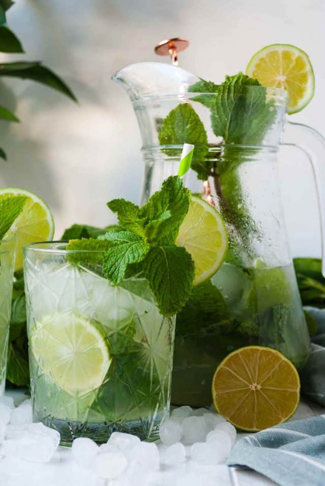 mojito pitcher recipe - a photo of a pitcher and a glass full of mojito drink
