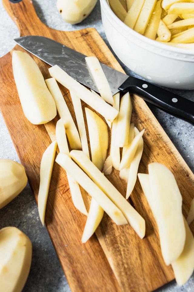 french fry recipe - close up photo of sliced potato on a cutting board