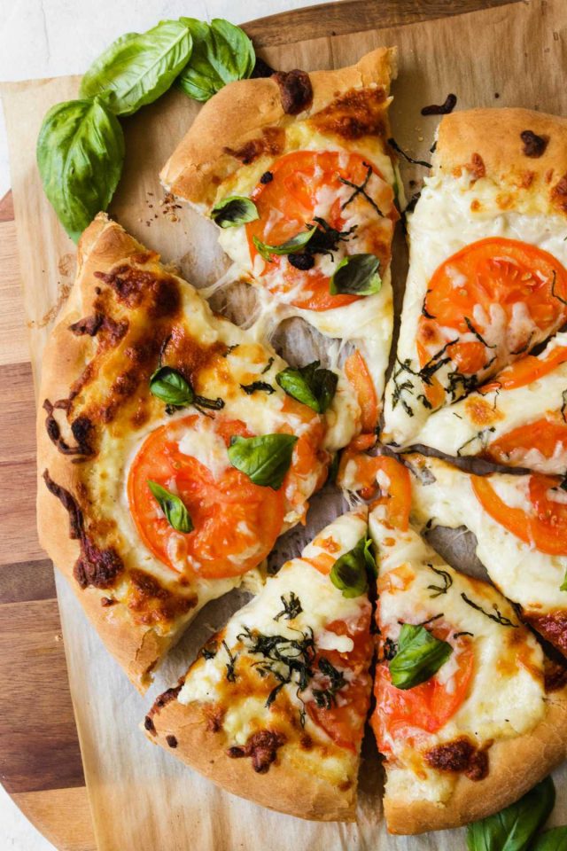 best white pizza - sliced white pizza divided into 8 slices