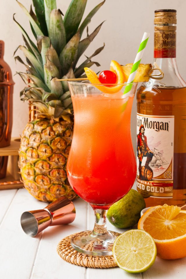 rum cocktails - red-orange colored served drink