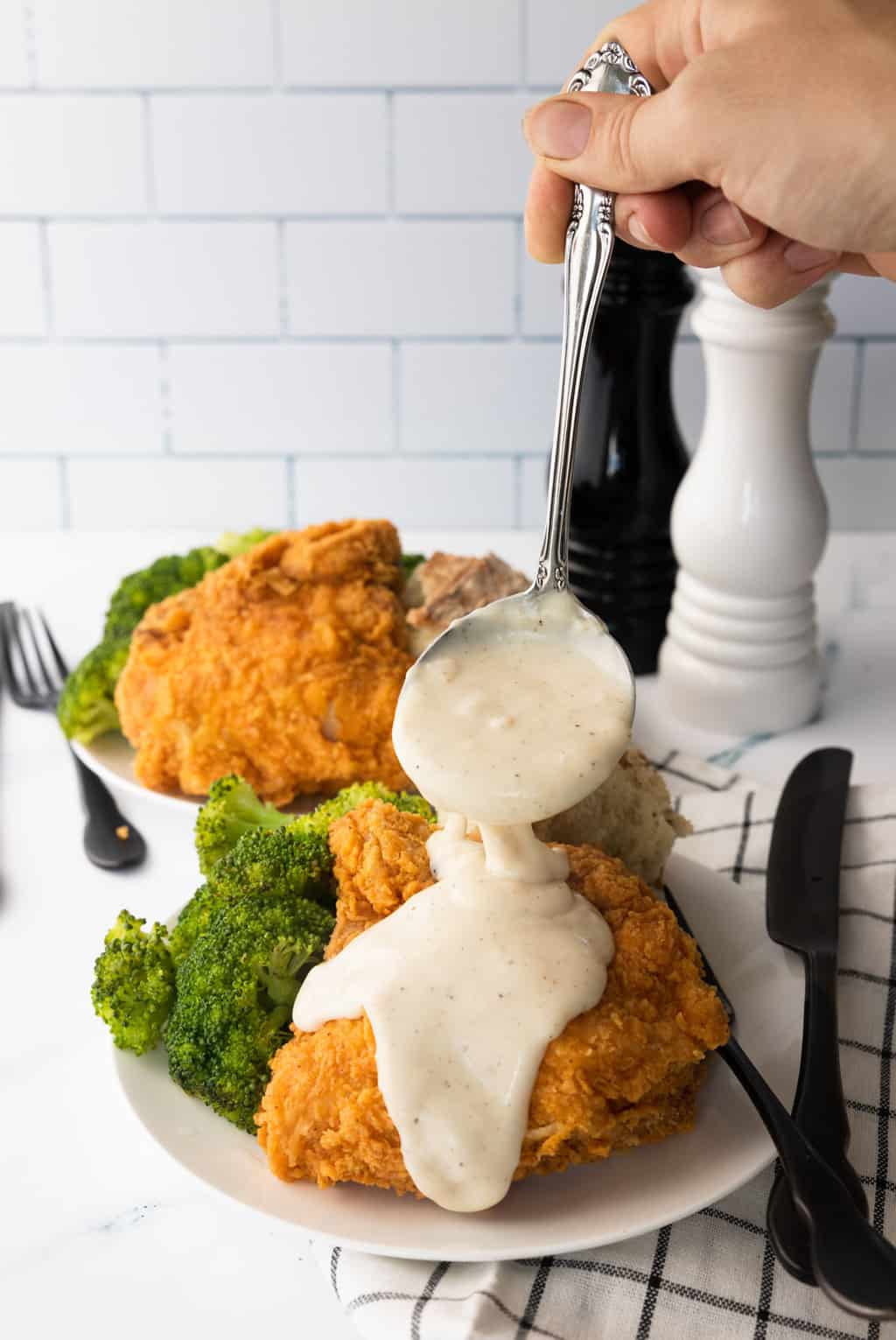 Country Gravy Recipe - photo of the white country gravy served with fried chicken
